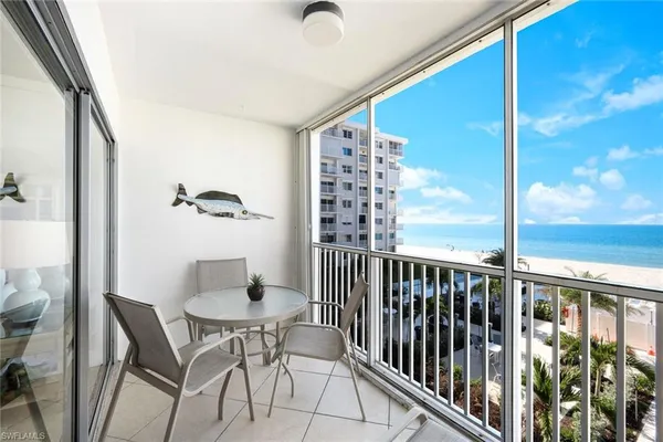 a view of a balcony with chairs