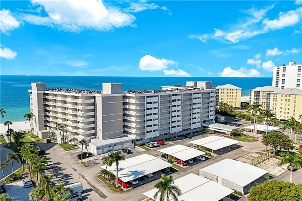 a view of a balcony with potted plants