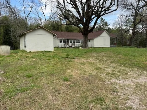 a house with trees in front of it
