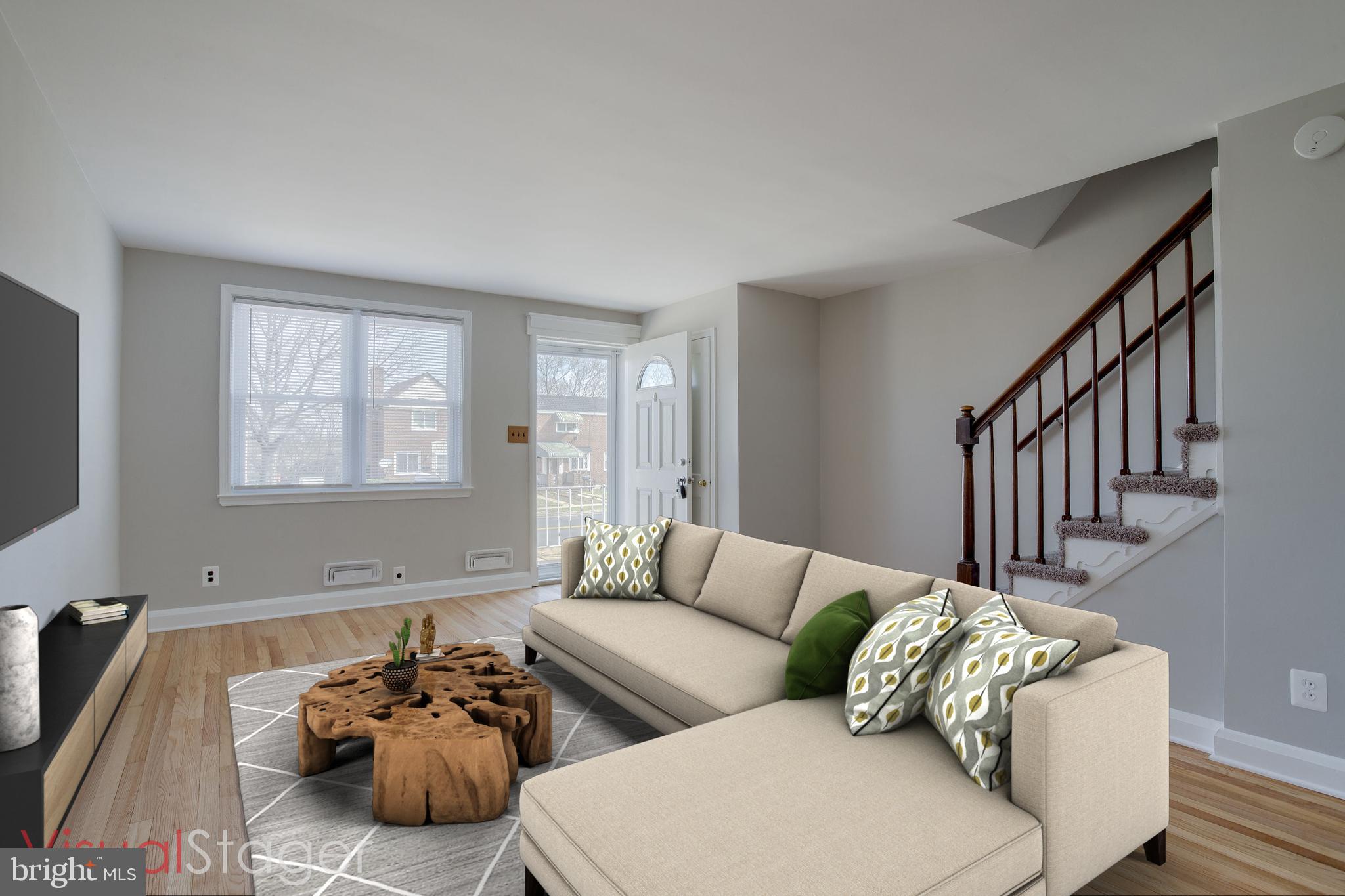 2255 Searles Road Baltimore, MD 21222 - Photo 2 of 13 a living room with furniture and a window