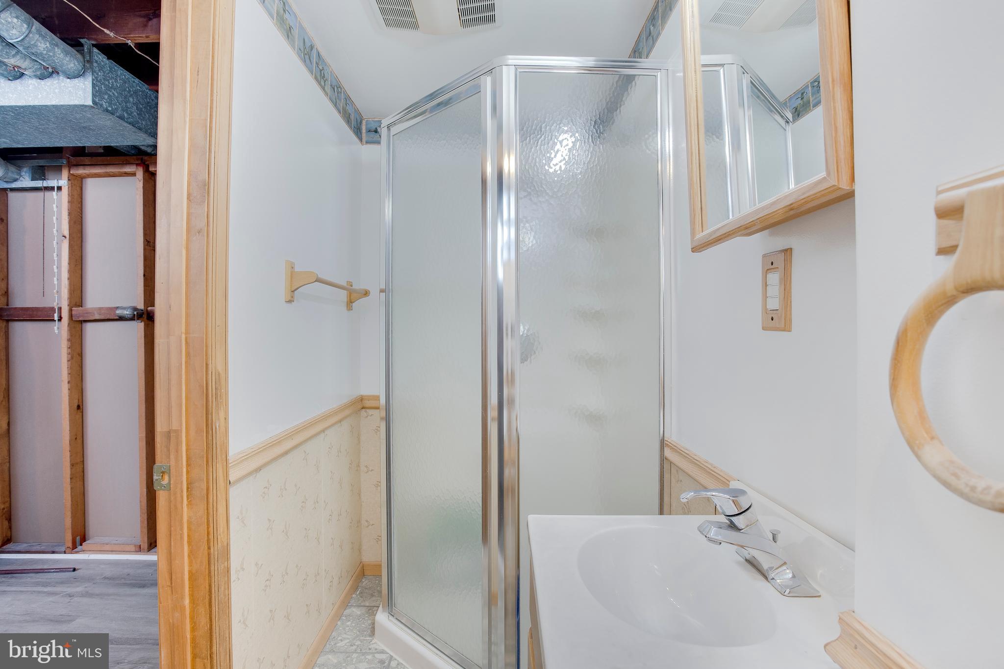 2255 Searles Road Baltimore, MD 21222 - Photo 11 of 13 a bathroom with a sink and a mirror