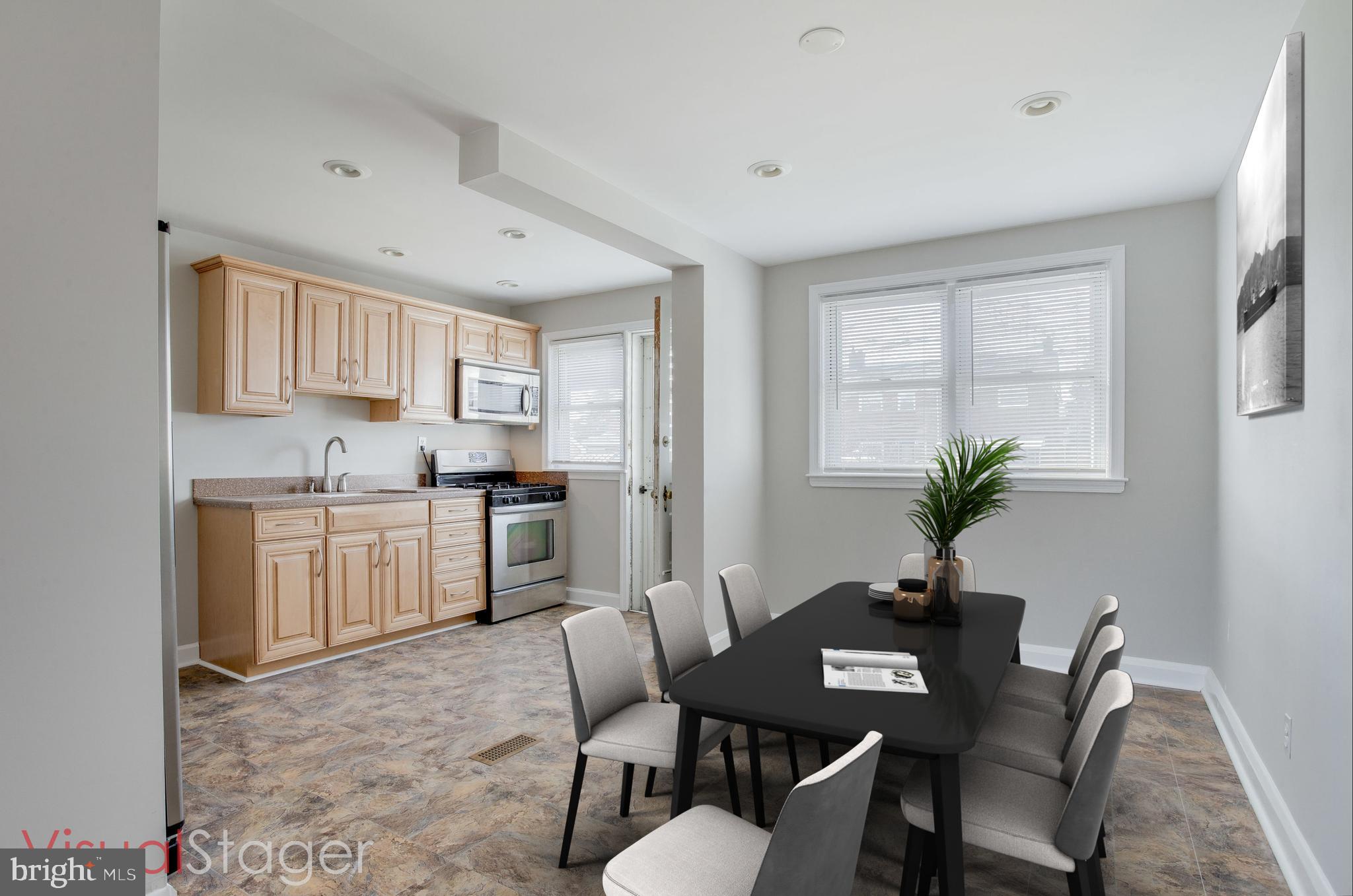 2255 Searles Road Baltimore, MD 21222 - Photo 3 of 13 a view of kitchen with a table and chairs in it