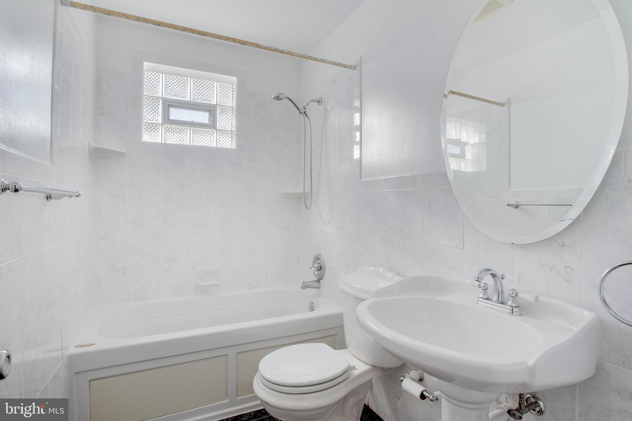 2255 Searles Road Baltimore, MD 21222 - Photo 6 of 13 a bathroom with a sink toilet and shower