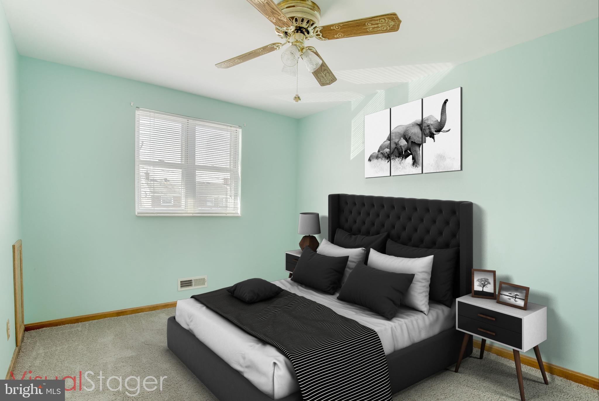 2255 Searles Road Baltimore, MD 21222 - Photo 7 of 13 a bed room with a bed and a chandelier