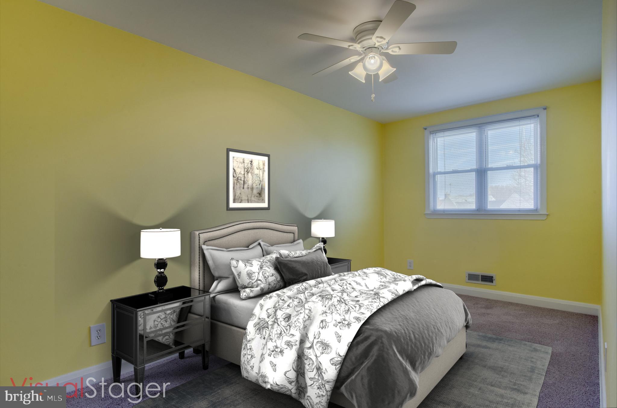 2255 Searles Road Baltimore, MD 21222 - Photo 8 of 13 a bedroom with a bed and a table in it