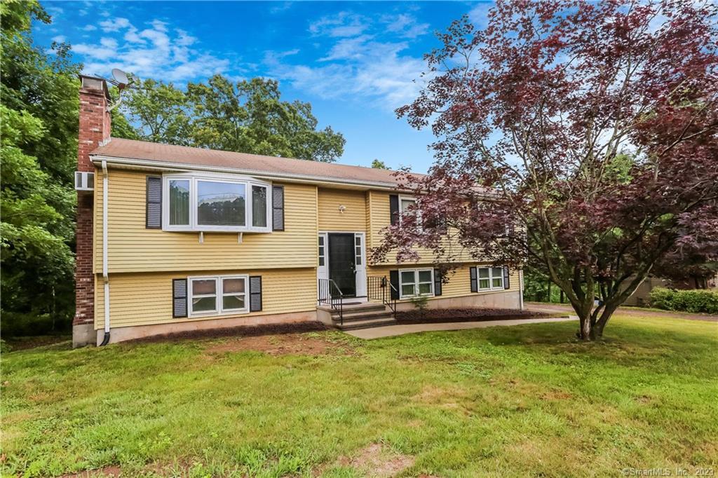 26 N Road Cromwell, CT 06416 - Photo 1 of 1 a front view of a house with a yard