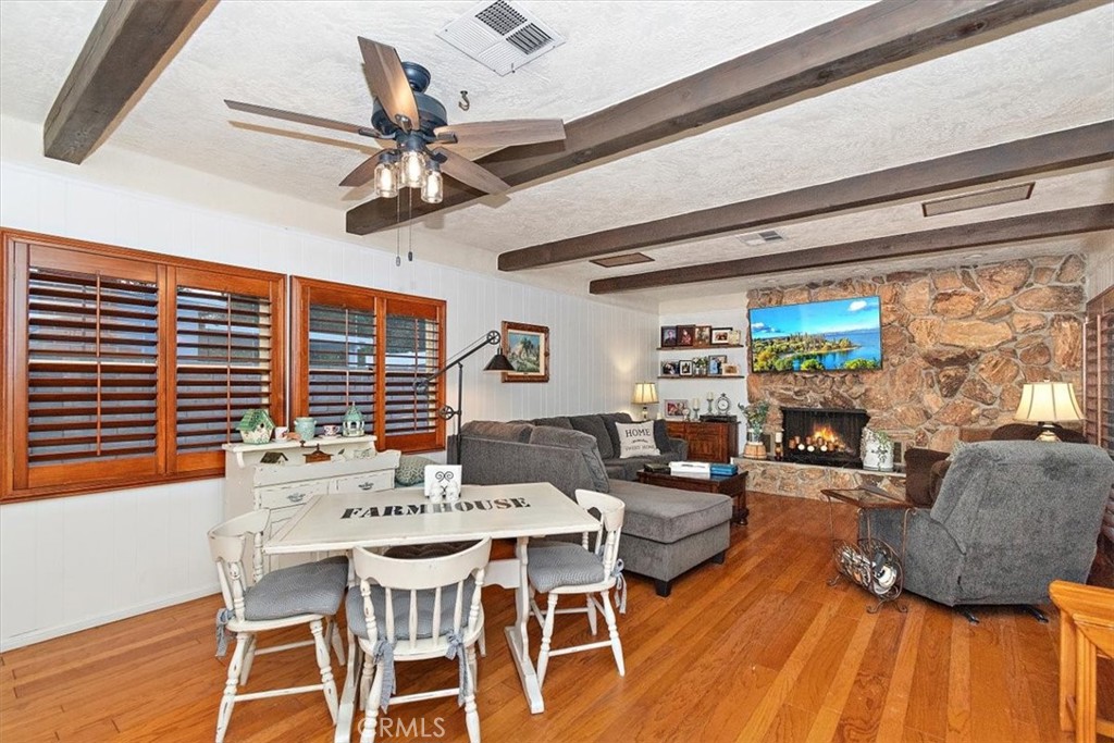 8530 Harmony Lane Riverside, CA 92504 - Photo 15 of 40 a view of a dining room with furniture window and wooden floor