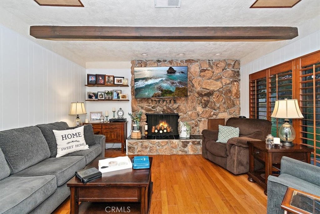 8530 Harmony Lane Riverside, CA 92504 - Photo 16 of 40 a living room with furniture and a fireplace