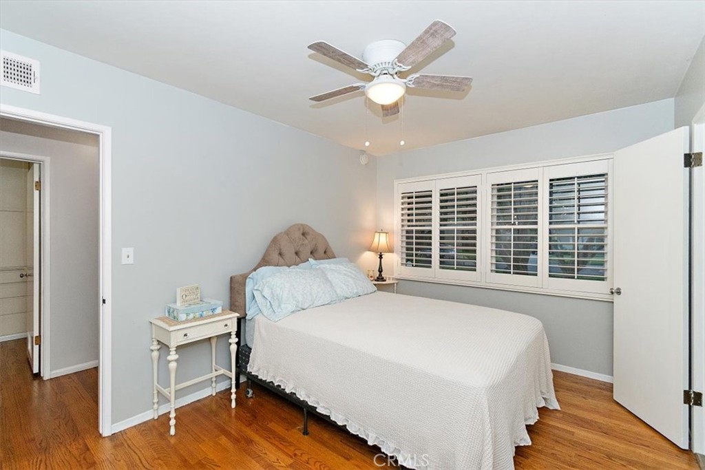 8530 Harmony Lane Riverside, CA 92504 - Photo 22 of 40 a bedroom with a large bed and a window