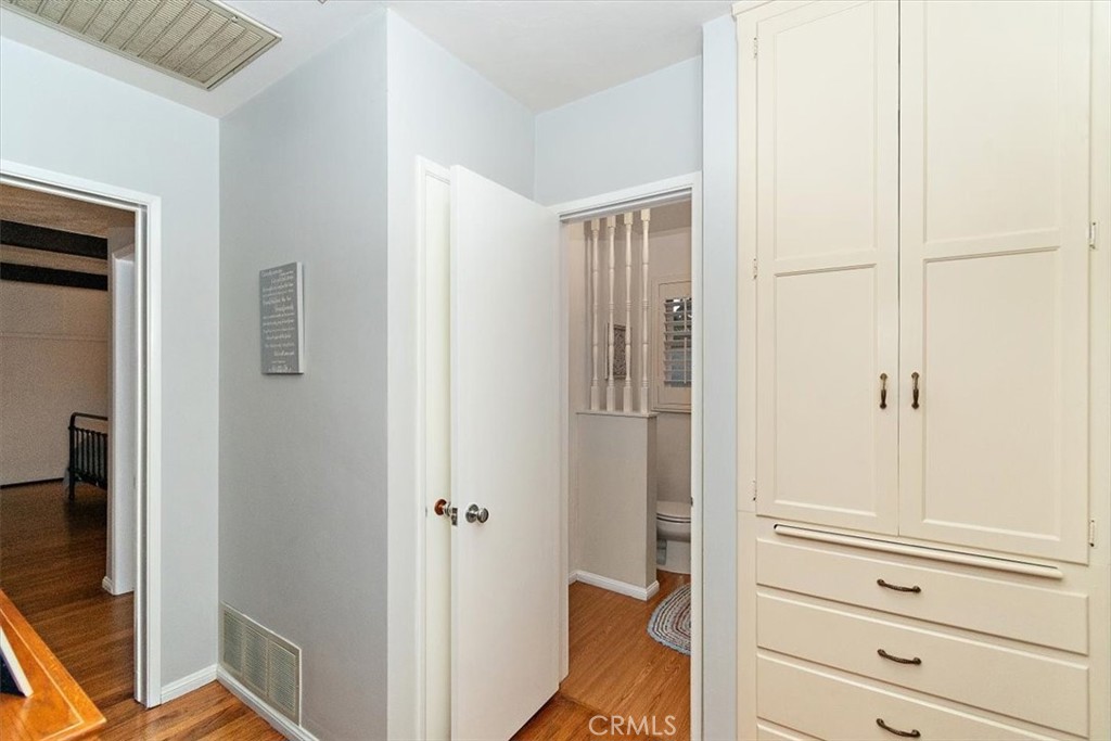 8530 Harmony Lane Riverside, CA 92504 - Photo 23 of 40 a view of a closet area with bedroom