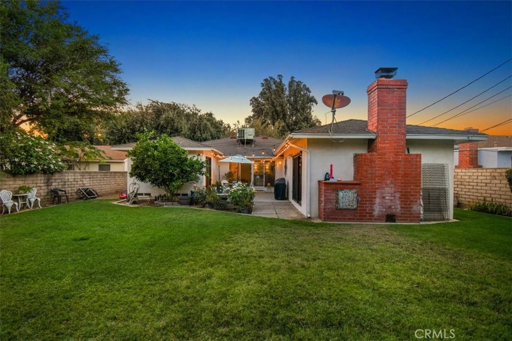 8530 Harmony Lane Riverside, CA 92504 - Photo 33 of 40 a front view of a house with a garden and plants