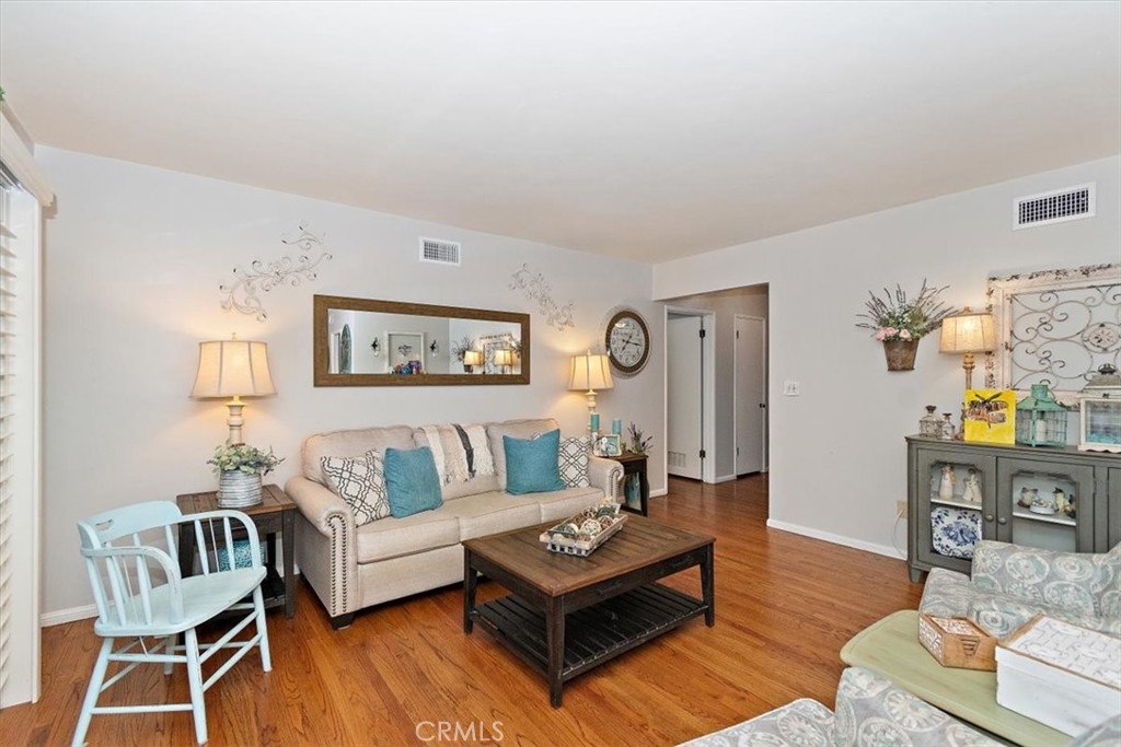 8530 Harmony Lane Riverside, CA 92504 - Photo 4 of 40 a living room with furniture and wooden floor