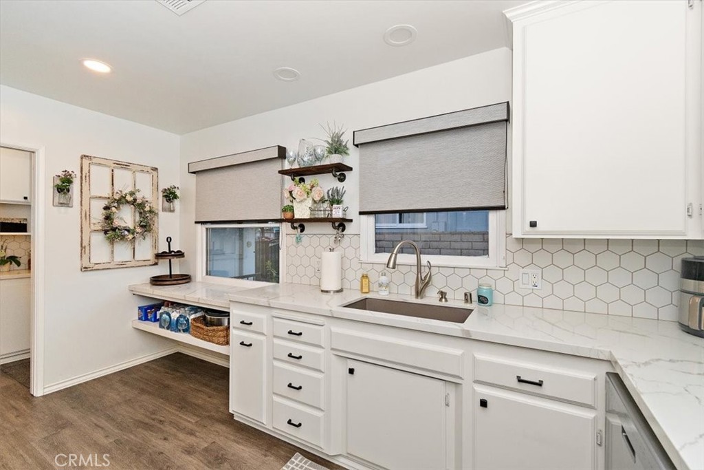 8530 Harmony Lane Riverside, CA 92504 - Photo 8 of 40 a kitchen with cabinets and appliances