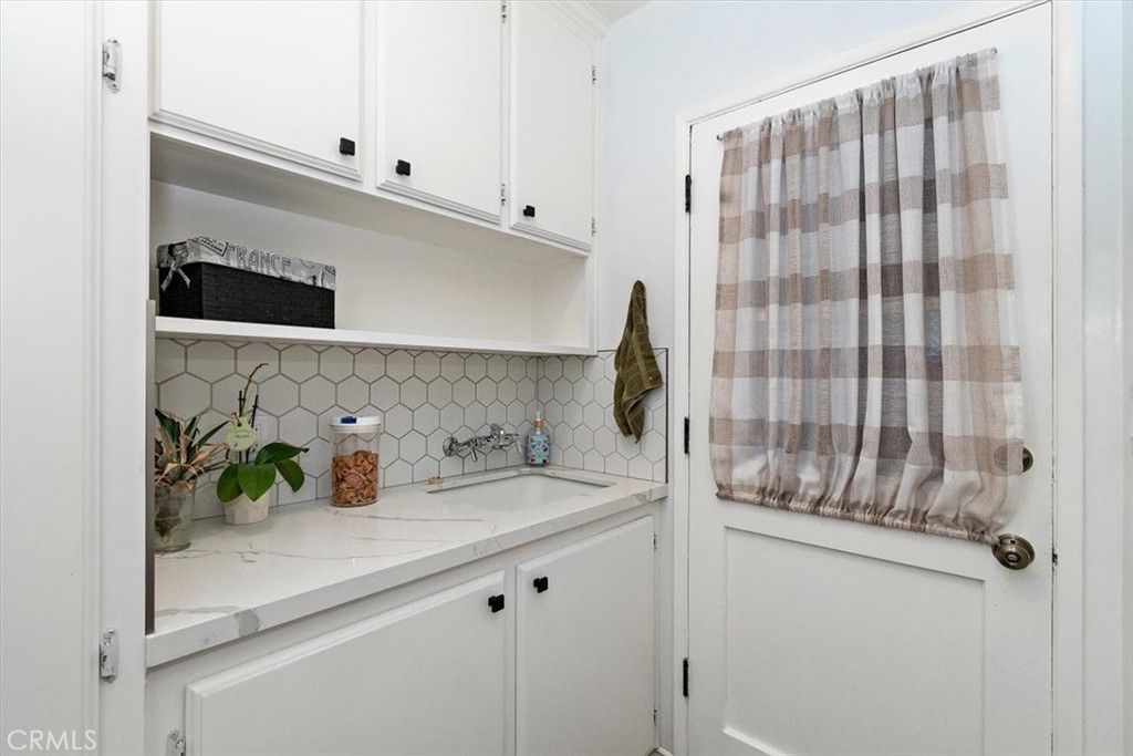 8530 Harmony Lane Riverside, CA 92504 - Photo 9 of 40 a kitchen with a sink and a window
