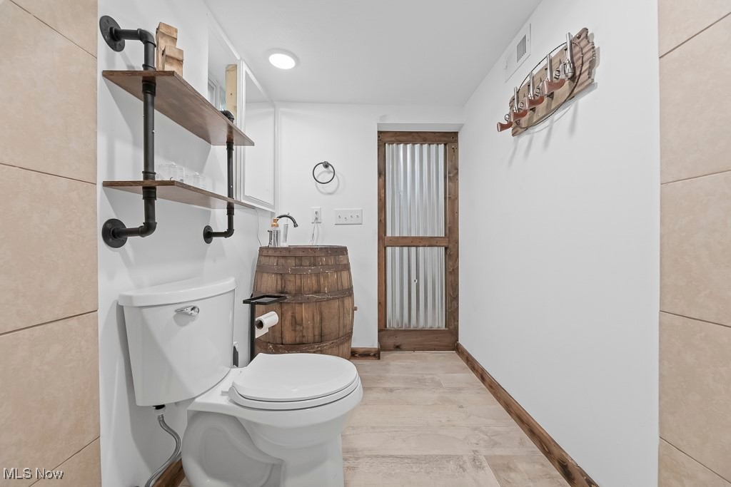 282 Johnson Road Wadsworth, OH 44281 - Photo 28 of 50 Bathroom with toilet and hardwood / wood-style flooring
