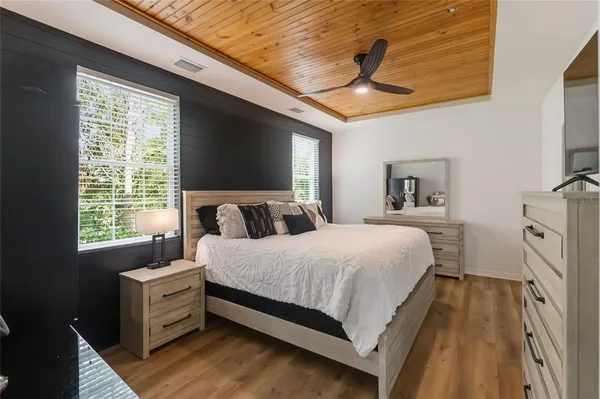 a bedroom with a bed and a couch