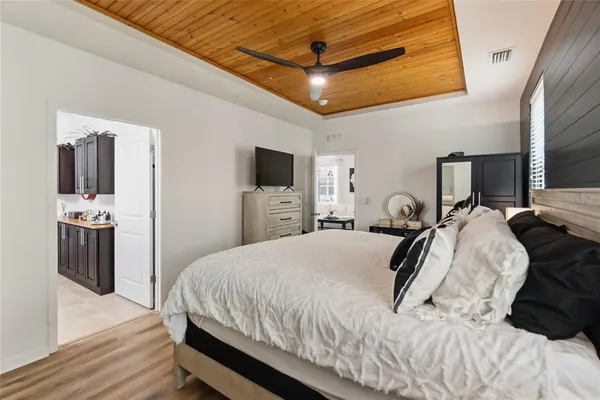 a bed room with a bed and a television