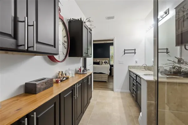 a kitchen with a sink stove and cabinets