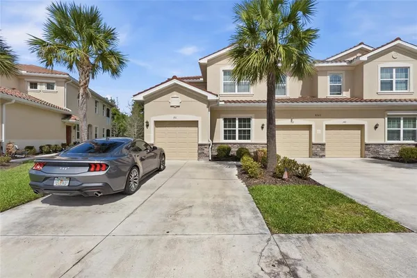 a view of a car parked in front of a house