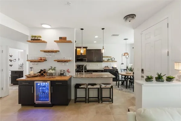 a kitchen with a table and chairs in it