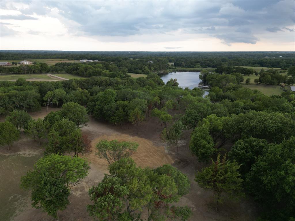 Lot 2 County Road 534 Whitewright, TX 75491 - Photo 14 of 27 an aerial view of green landscape with trees houses and mountain view