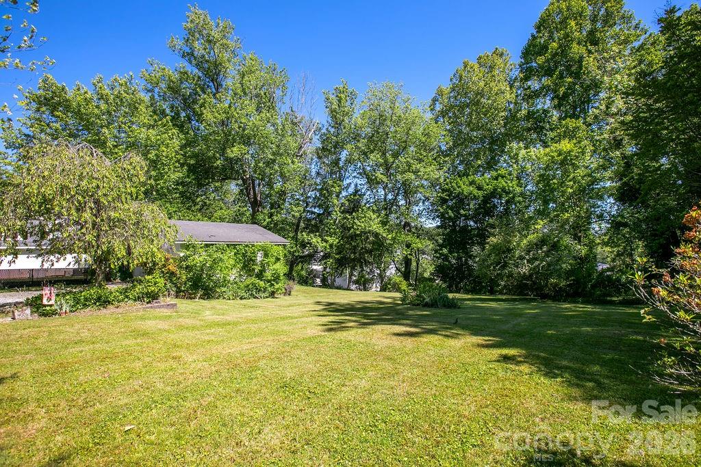 208 West Probart Street Brevard, NC 28712 - Photo 47 of 48 a view of a swimming pool with a garden