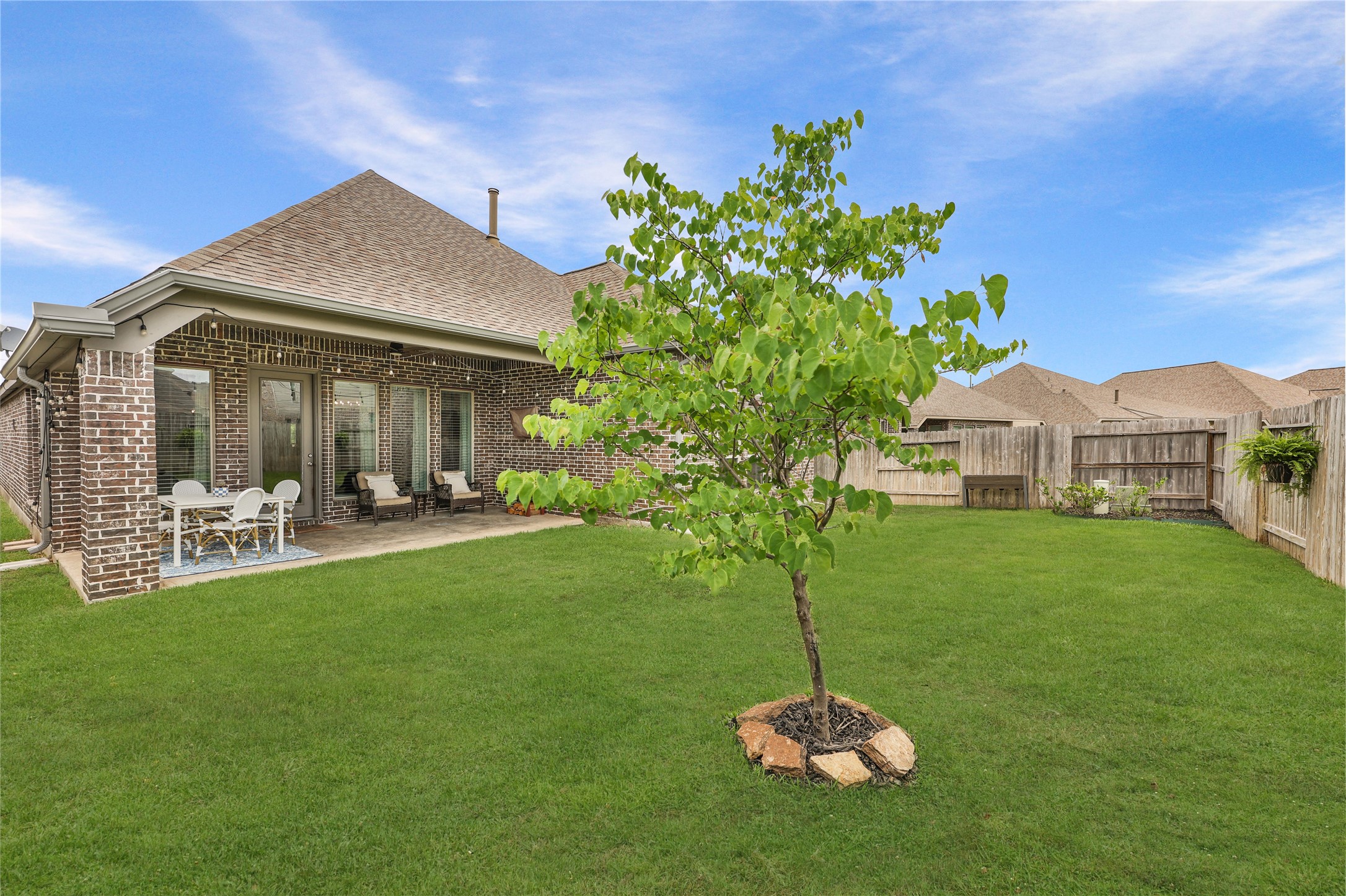 28169 Knight Peak Drive Spring, TX 77386 - Photo 27 of 33 a big house with a big yard and potted plants