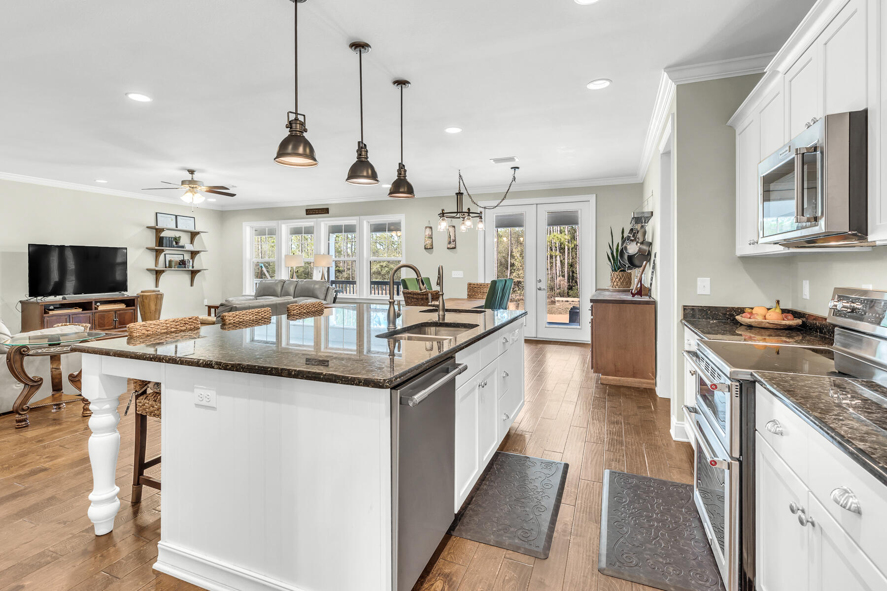 453 Don Graff Road Freeport, FL 32439 - Photo 19 of 59 a kitchen with stainless steel appliances granite countertop a sink a stove and a wooden floors