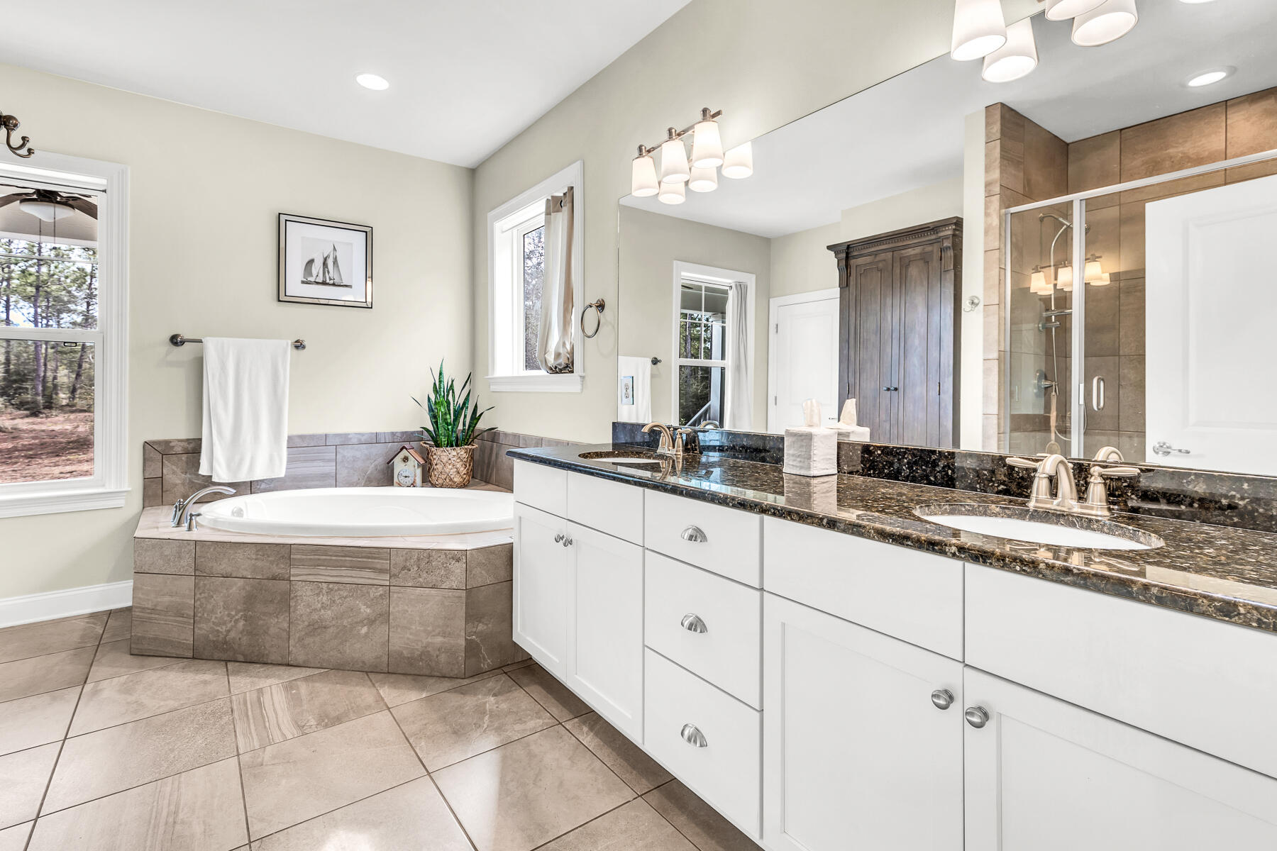 453 Don Graff Road Freeport, FL 32439 - Photo 26 of 59 a spacious bathroom with a granite countertop sink mirror and bathtub