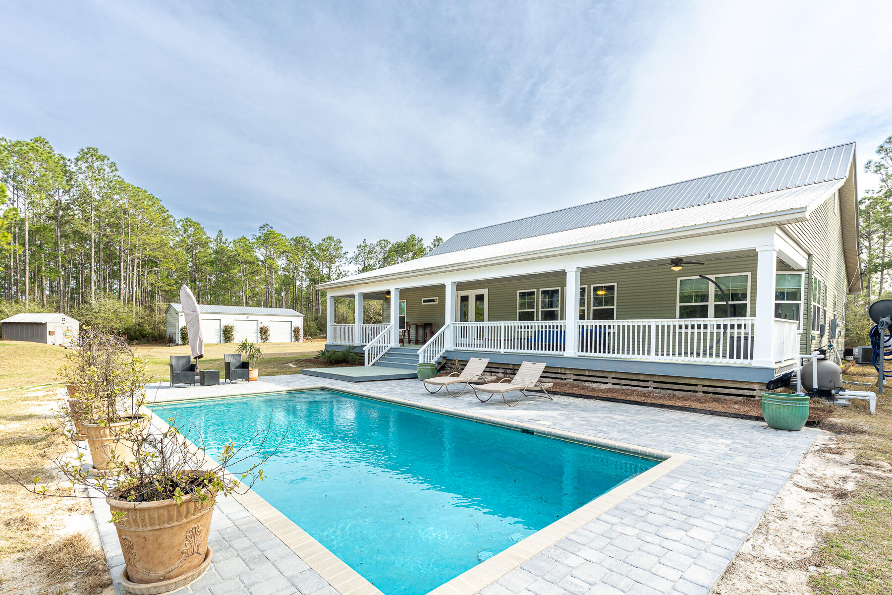 453 Don Graff Road Freeport, FL 32439 - Photo 39 of 59 a view of a house with swimming pool and sitting area