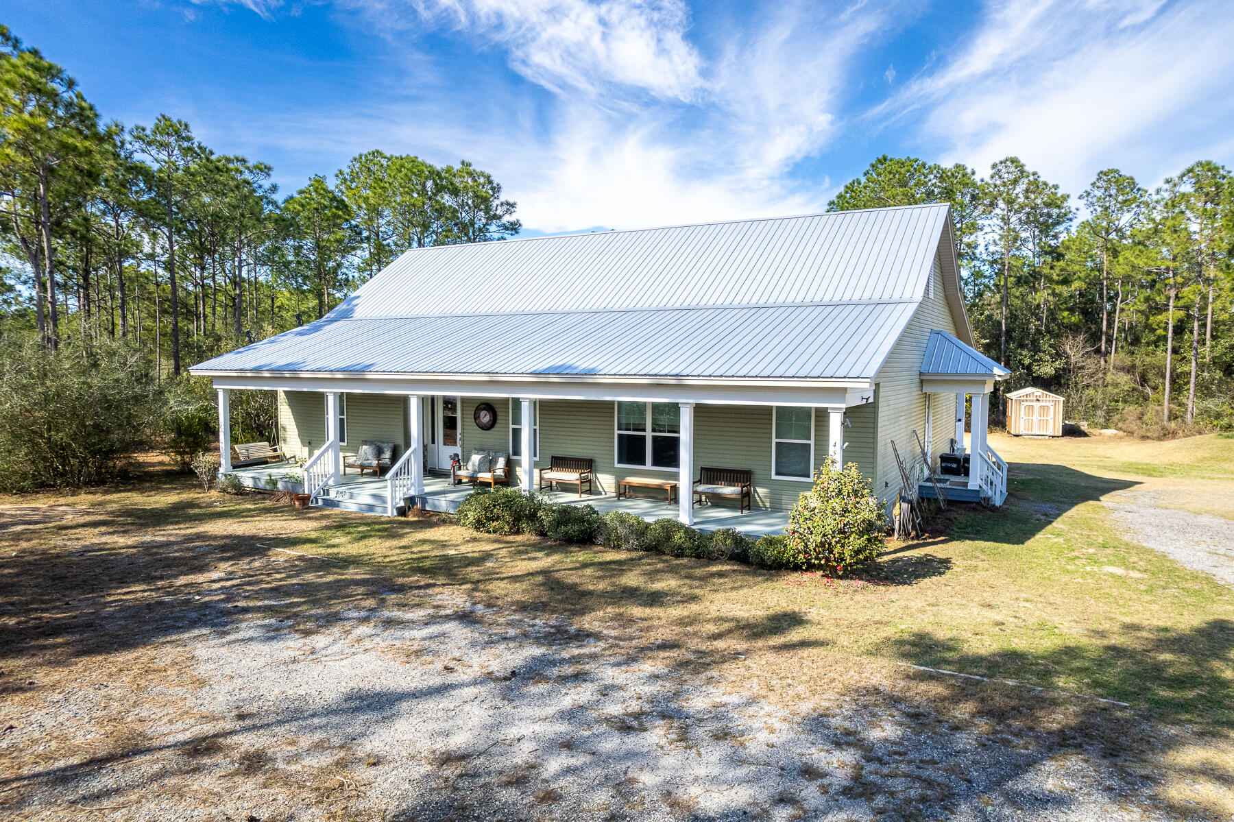 453 Don Graff Road Freeport, FL 32439 - Photo 56 of 59 a front view of a house with yard patio and outdoor seating