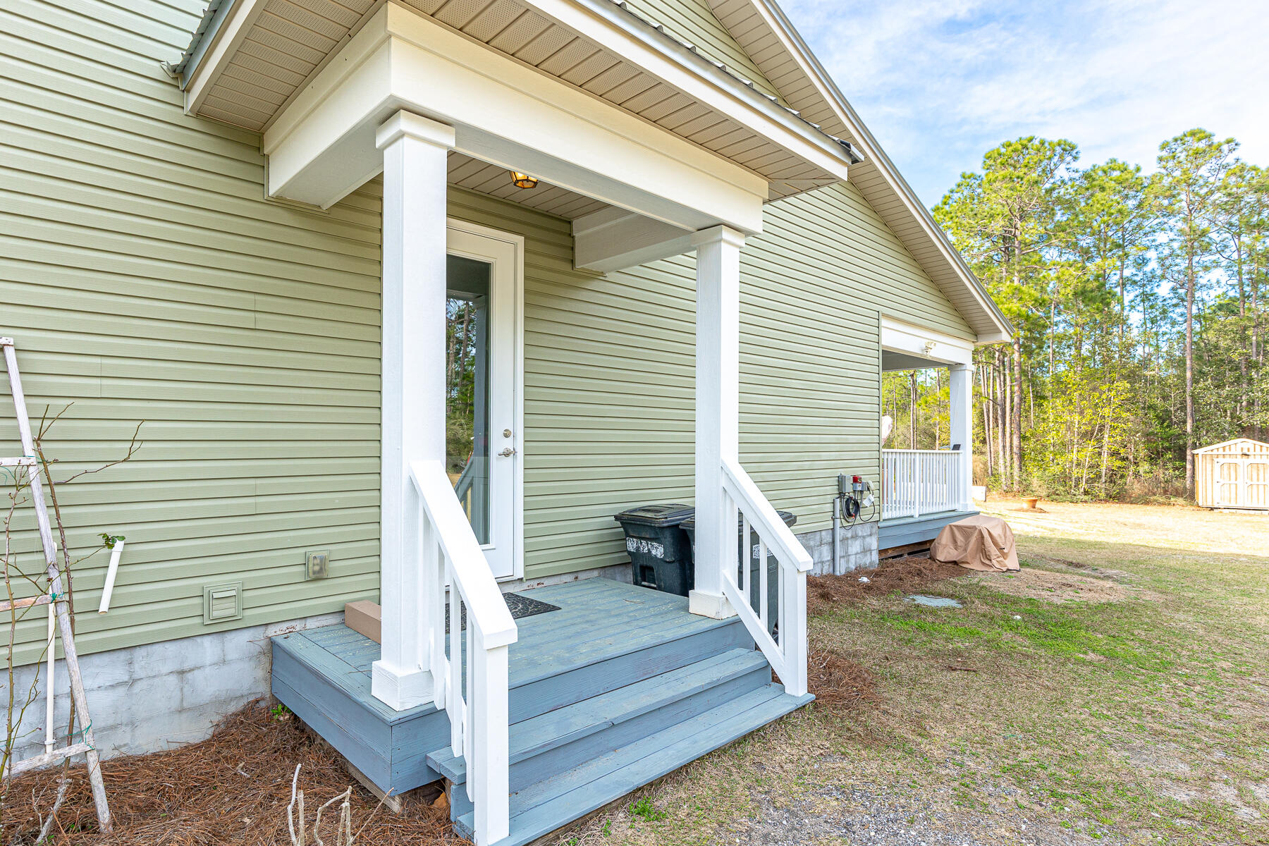 453 Don Graff Road Freeport, FL 32439 - Photo 57 of 59 a front view of a house with a porch