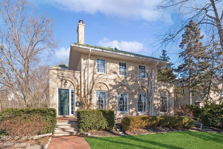 730 Sheridan Road Wilmette, IL 60091 - Photo 1 of 43 a front view of a house with garden
