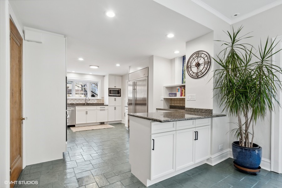 730 Sheridan Road Wilmette, IL 60091 - Photo 16 of 43 a kitchen with a sink and a stove top oven