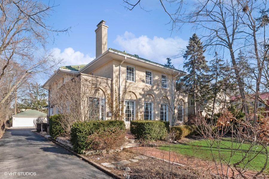 730 Sheridan Road Wilmette, IL 60091 - Photo 2 of 43 a front view of a house with garden