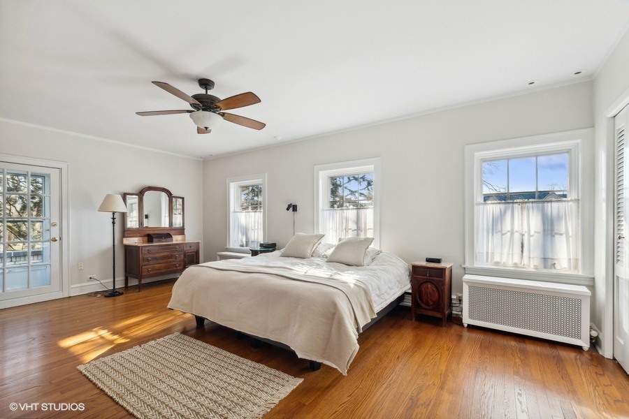730 Sheridan Road Wilmette, IL 60091 - Photo 23 of 43 a bedroom with a bed and a chandelier