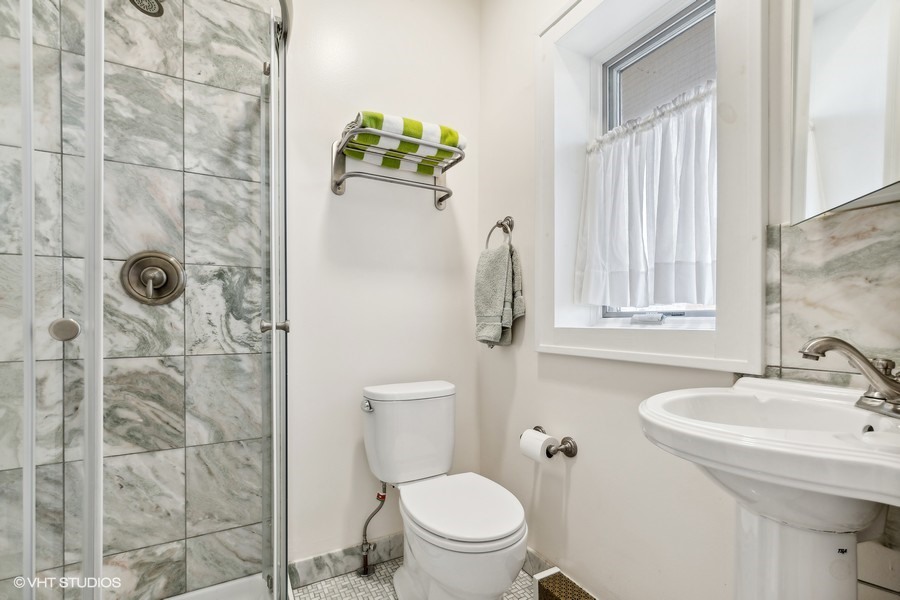 730 Sheridan Road Wilmette, IL 60091 - Photo 27 of 43 a bathroom with a sink toilet and shower