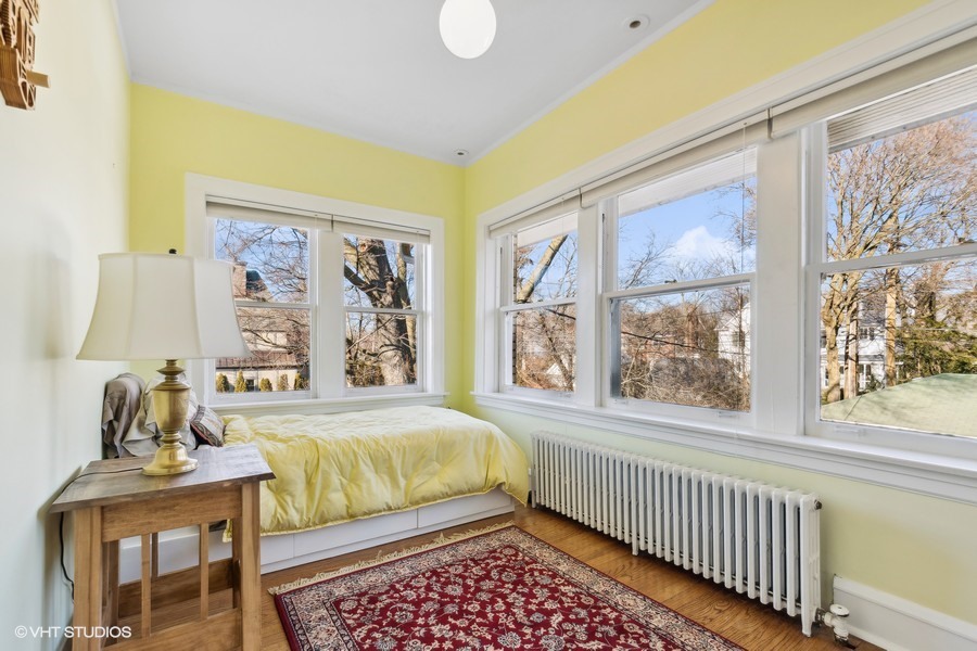 730 Sheridan Road Wilmette, IL 60091 - Photo 29 of 43 a bedroom with a bed and wooden floor