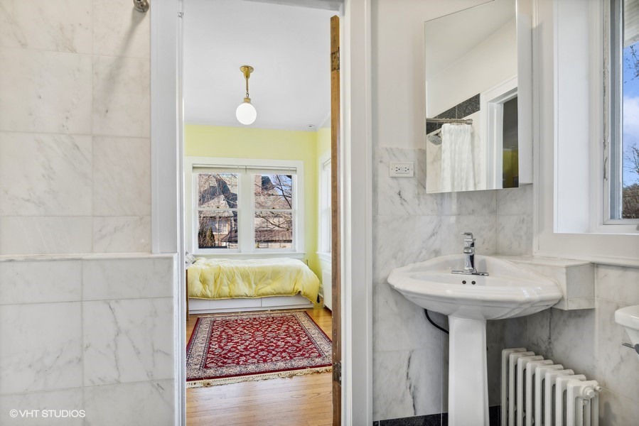 730 Sheridan Road Wilmette, IL 60091 - Photo 30 of 43 a bathroom with a sink and a mirror