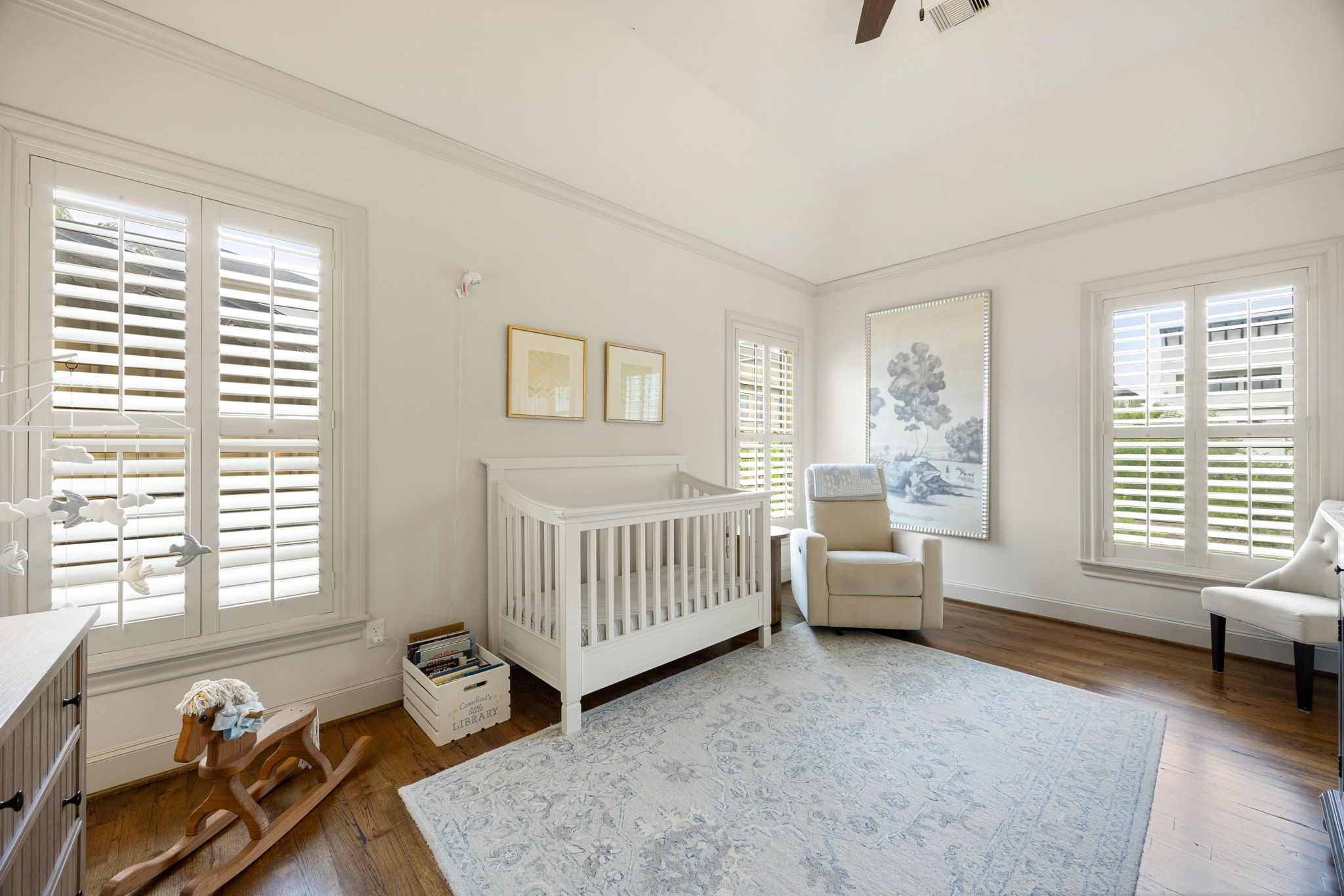 310 West Bell Street Houston, TX 77019 - Photo 36 of 44 This secondary bedroom is being used as a nursery. The hardwood floors and large windows make it a beautiful space for a bedroom, office or flex room. It has it's own private full bathroom as well.