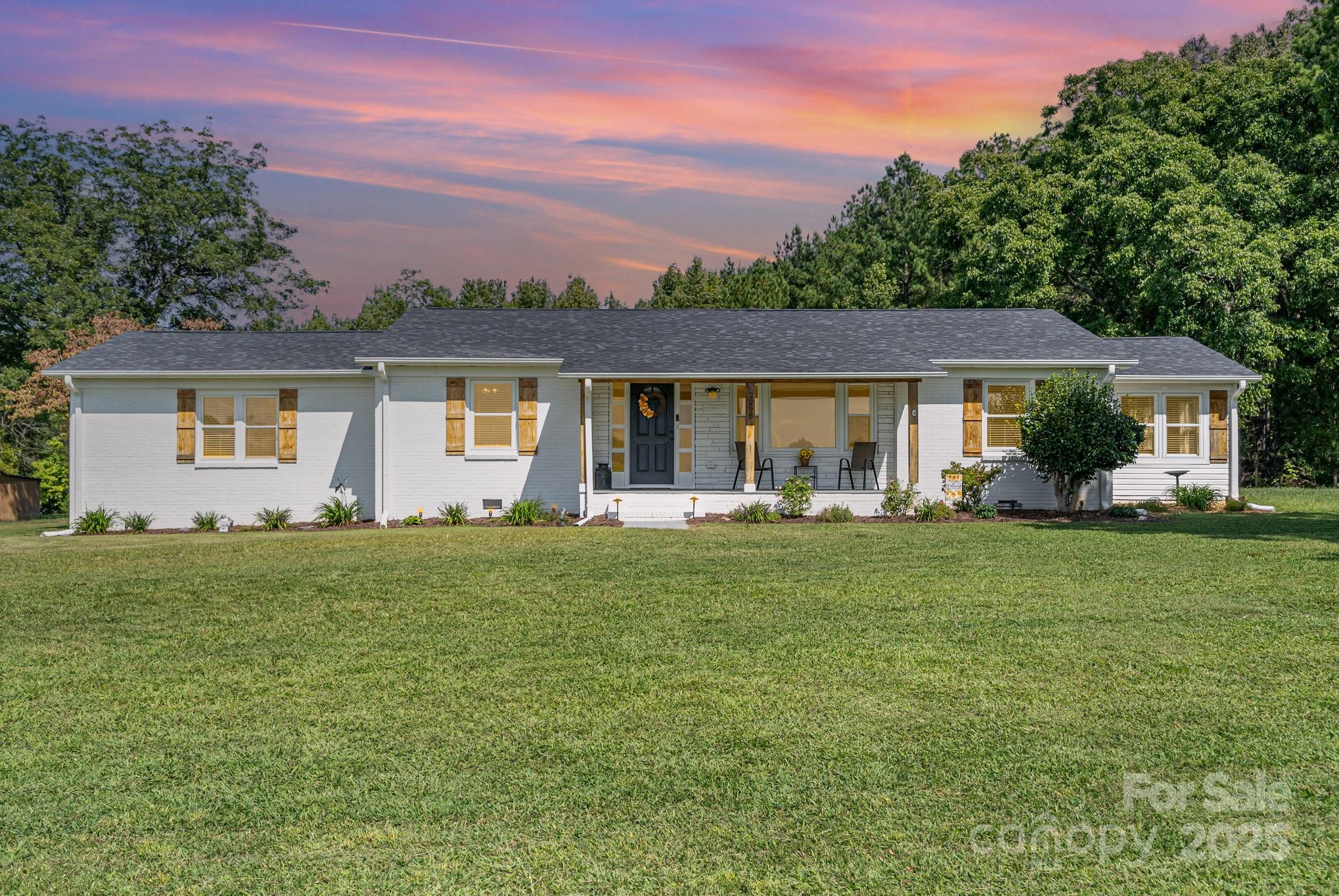 2295 Emanuel Church Road Rockwell, NC 28138 - Photo 1 of 33 a front view of house with yard and green space
