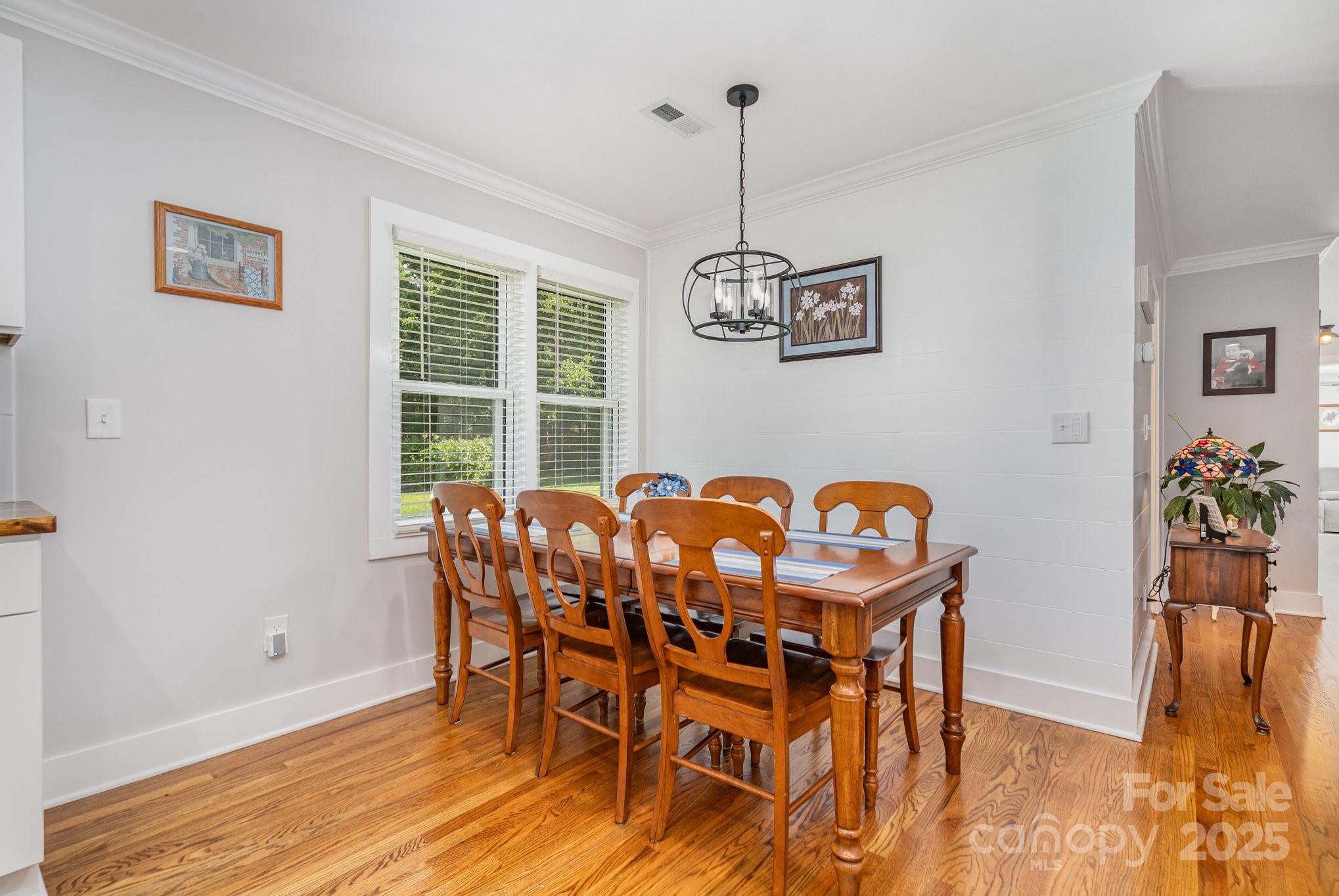 2295 Emanuel Church Road Rockwell, NC 28138 - Photo 11 of 33 a view of a dining room with furniture window and wooden floor