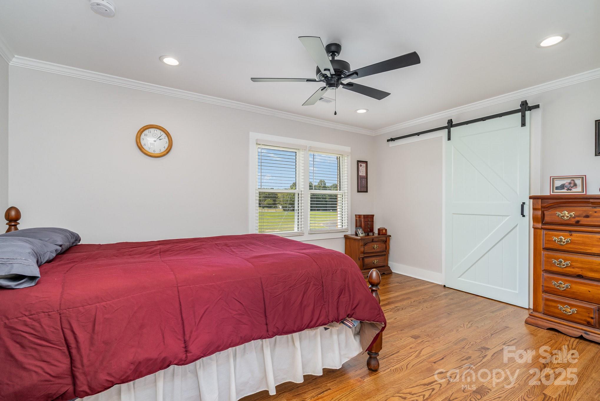 2295 Emanuel Church Road Rockwell, NC 28138 - Photo 17 of 33 a bedroom with a bed and a window
