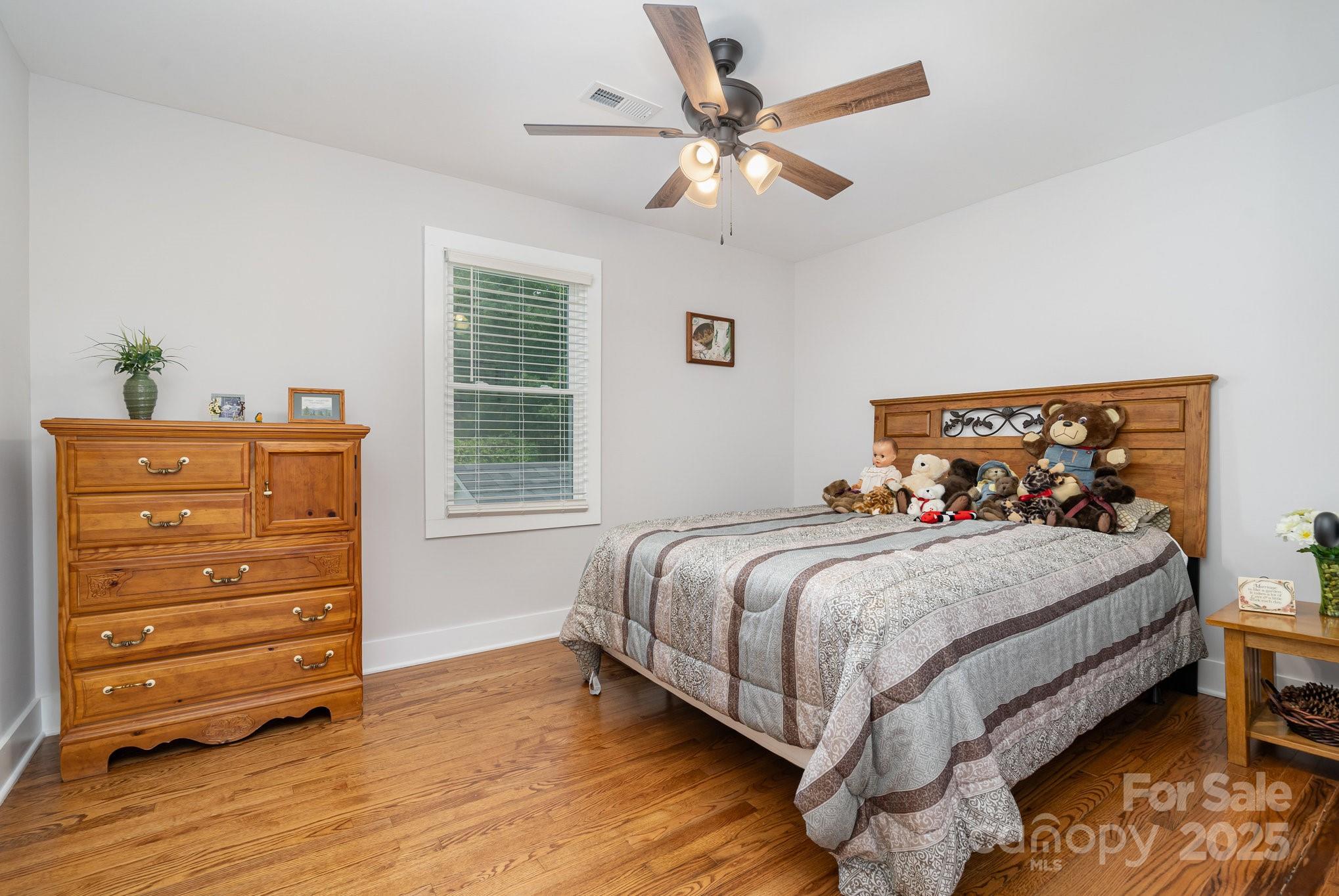 2295 Emanuel Church Road Rockwell, NC 28138 - Photo 20 of 33 a bedroom with a bed and a dresser