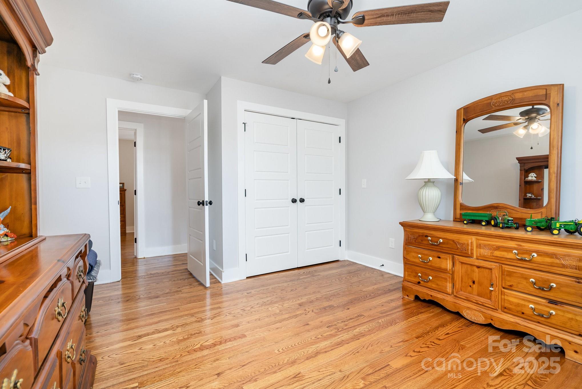 2295 Emanuel Church Road Rockwell, NC 28138 - Photo 22 of 33 a view of a room with wooden floor cabinet and a mirror