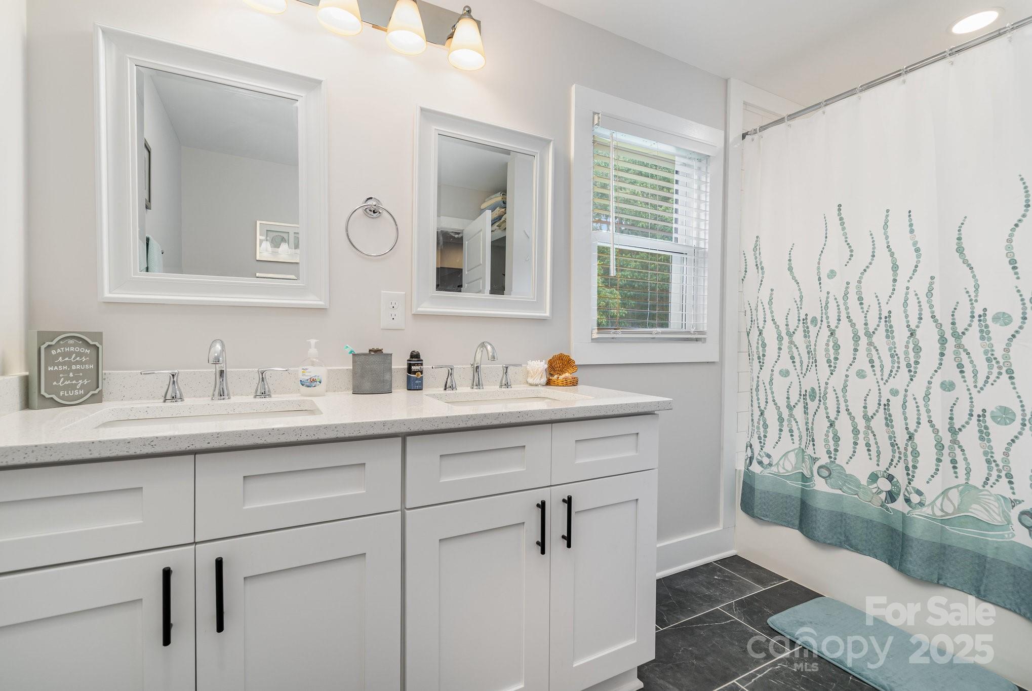 2295 Emanuel Church Road Rockwell, NC 28138 - Photo 24 of 33 a bathroom with a sink and a mirror