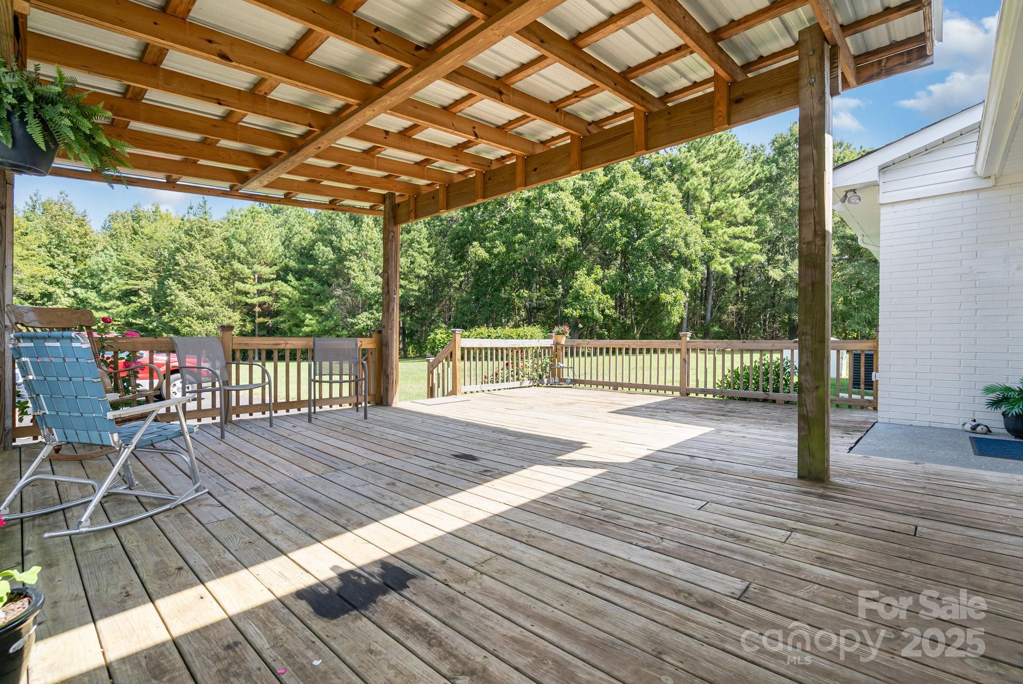2295 Emanuel Church Road Rockwell, NC 28138 - Photo 27 of 33 a patio that has a table and chairs with wooden floor