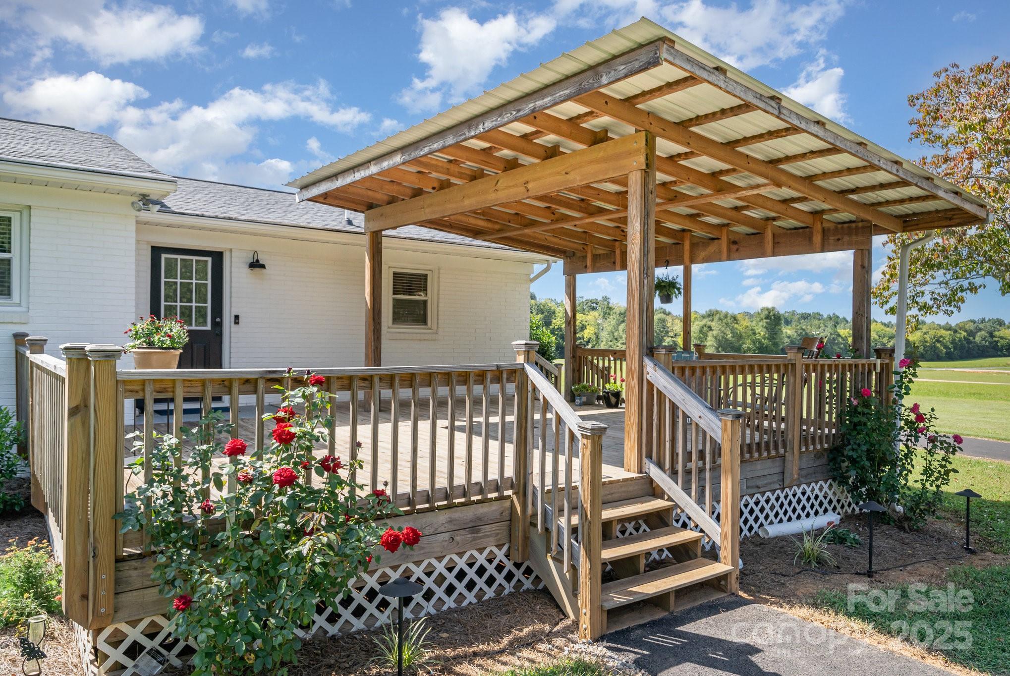 2295 Emanuel Church Road Rockwell, NC 28138 - Photo 28 of 33 a front view of a house with a garden