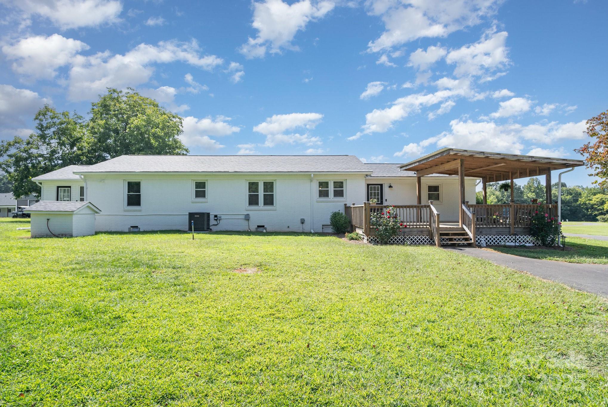 2295 Emanuel Church Road Rockwell, NC 28138 - Photo 29 of 33 a view of a house with backyard and sitting area