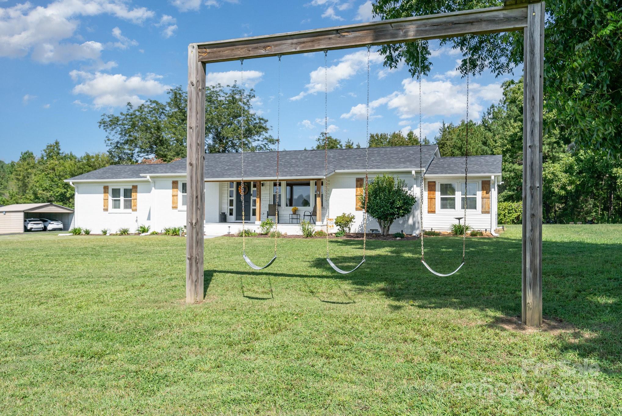 2295 Emanuel Church Road Rockwell, NC 28138 - Photo 3 of 33 a view of a house with backyard